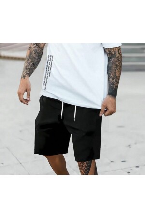 Schwarze, locker geschnittene Shorts in Übergröße - The White